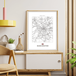 Left view of Manchester wall artwork map, featuring detailed landscapes and key landmarks in an artistic design.