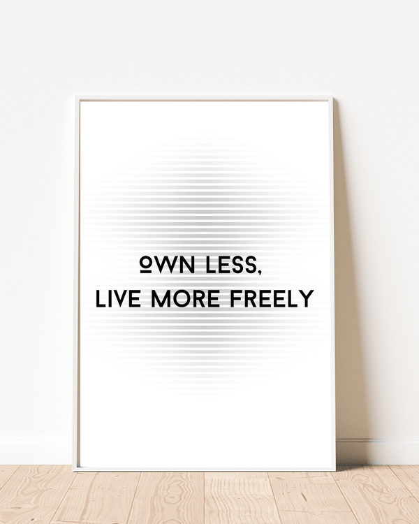  Front view of wall art featuring the quote 'Own less, live more' in elegant typography