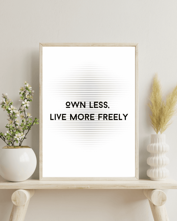  Front view of wall art featuring the quote 'Own less, live more' in elegant typography of a bed room mockup