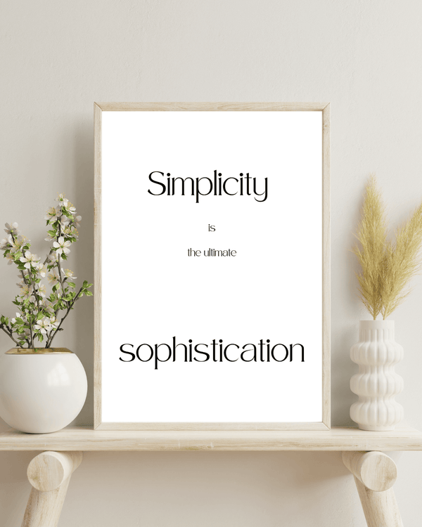 Front view of wall art featuring the quote 'Simplicity is the ultimate sophistication' in elegant typography of a living room mockup