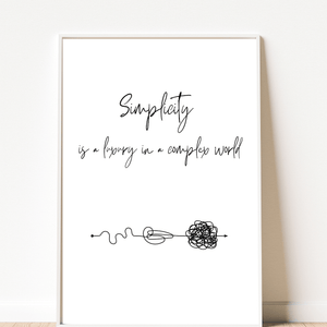 Artistic representation of the quote ' Simplicity is a luxury in a complex world' in a decorative wall print, ideal for inspiration in a living room mockup