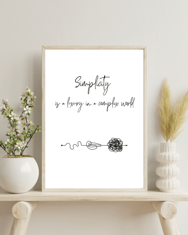 Artistic representation of the quote ' Simplicity is a luxury in a complex world' in a decorative wall print, ideal for inspiration in a study room mockup